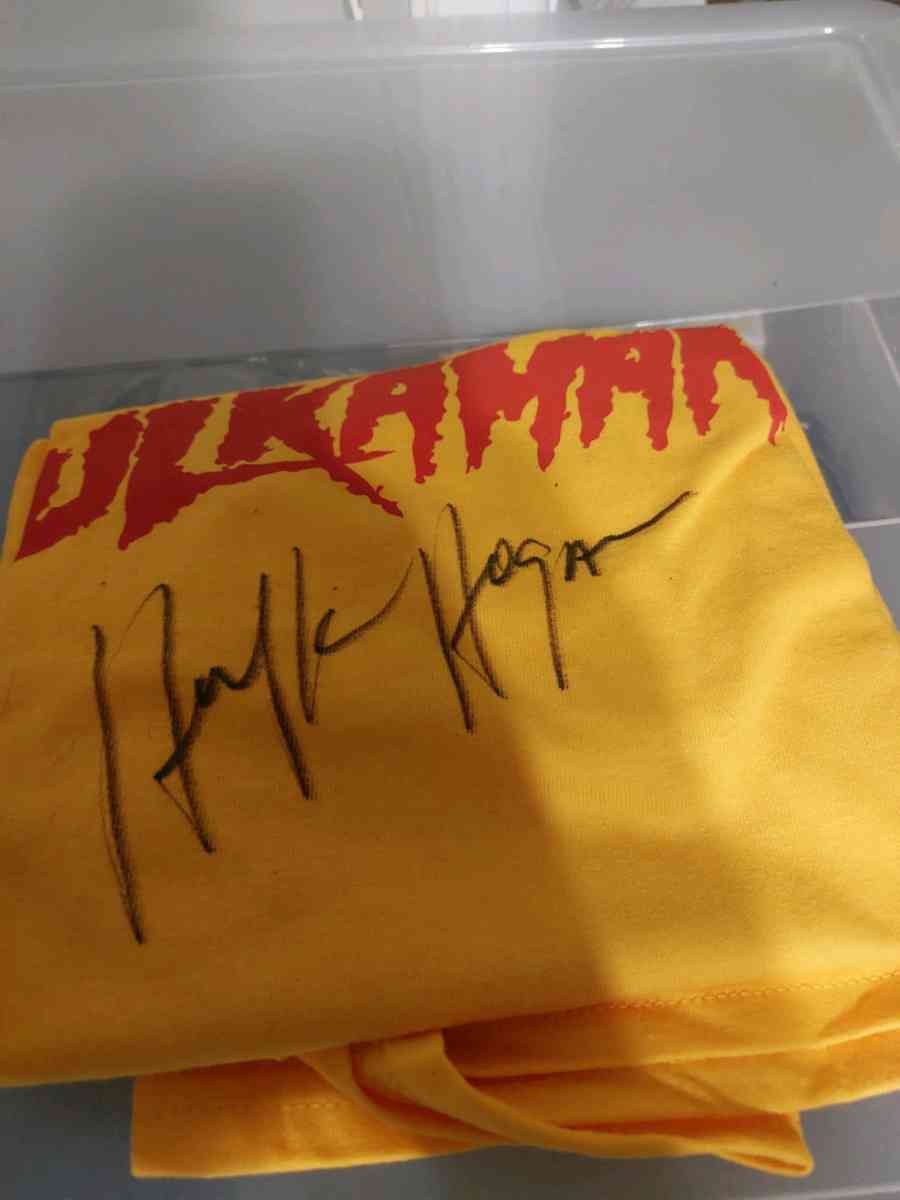 red and yellow autographed Tshirt