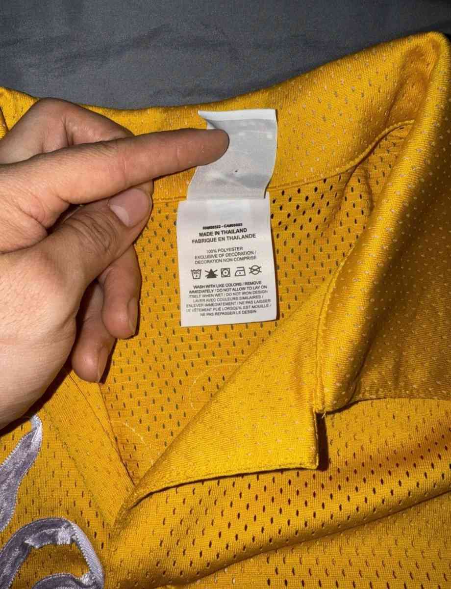 yellow Nike shirt