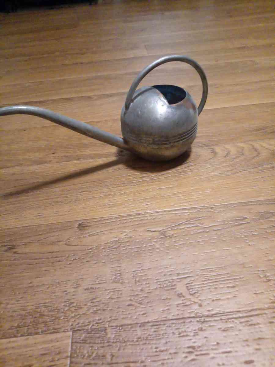 copper watering can