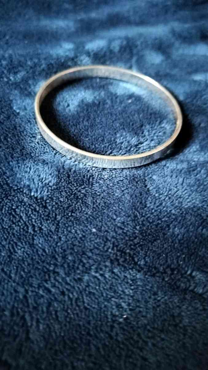 Two choker necklaces and a silver bracelet