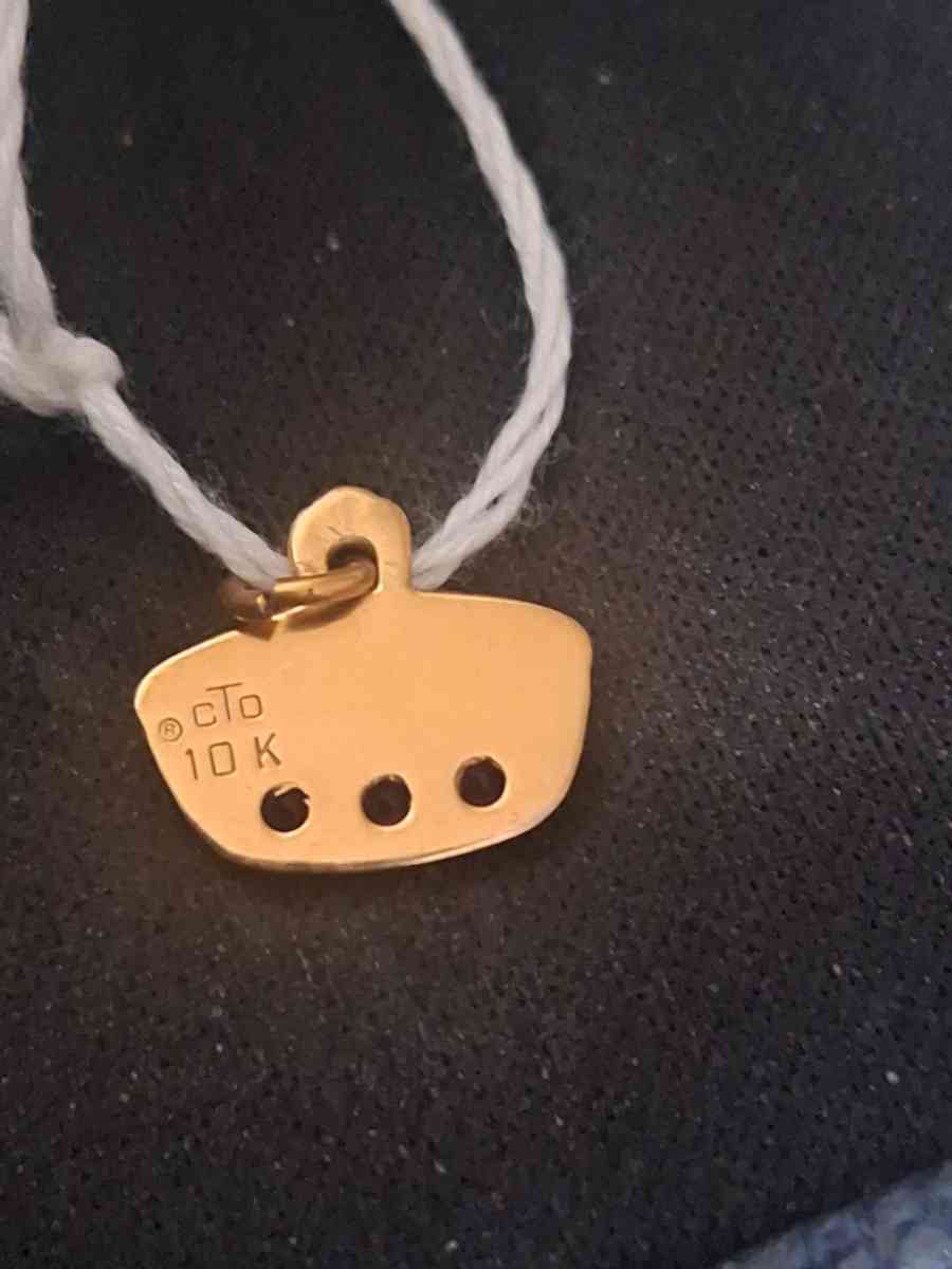 10K pendant  1 point 4 grams