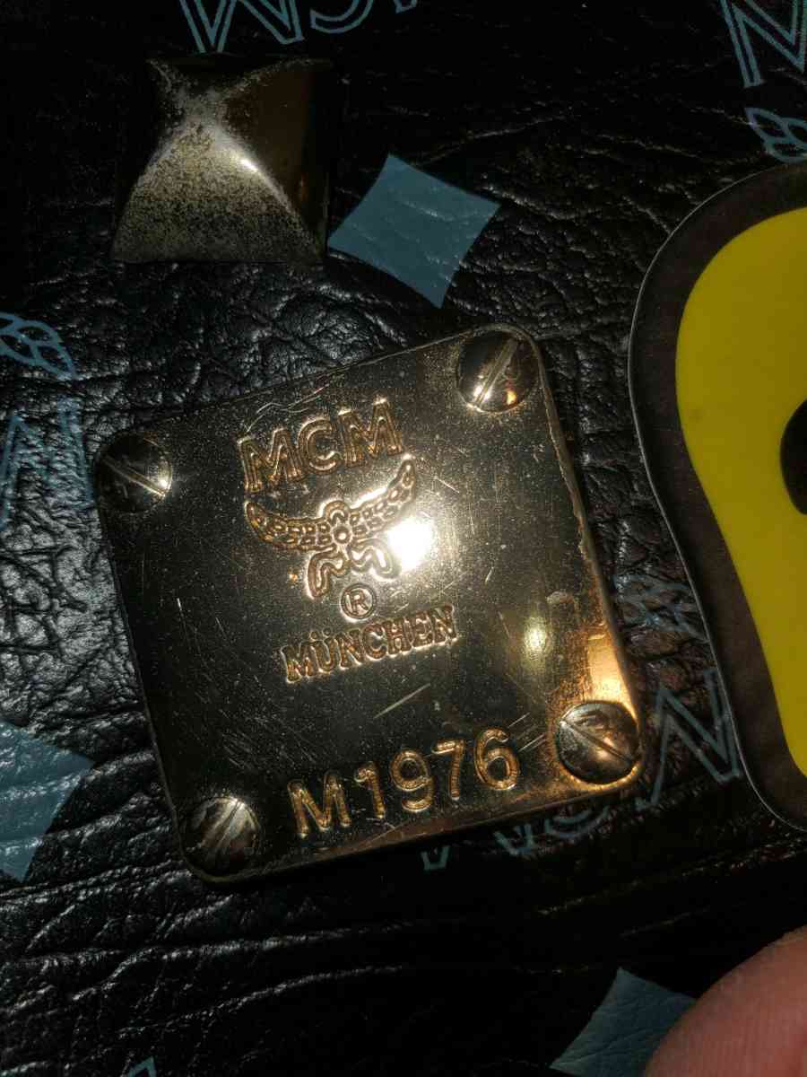 Mcm backpack black and gold