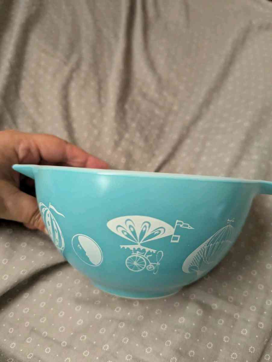 two sets of turquoise Pyrex vintage dishes