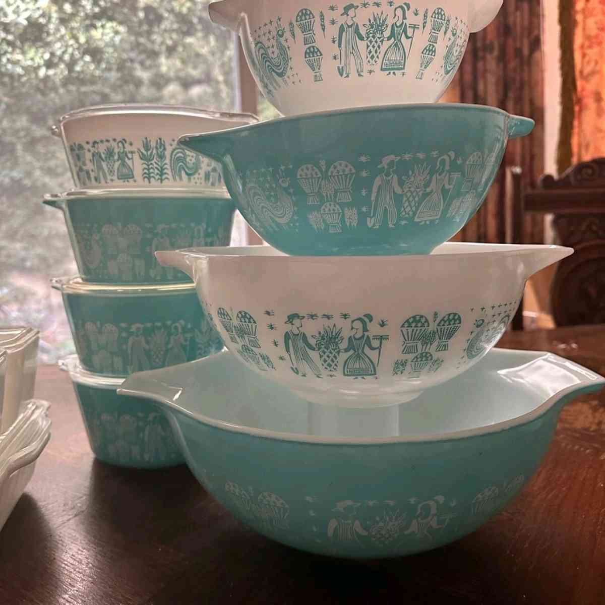 two sets of turquoise Pyrex vintage dishes