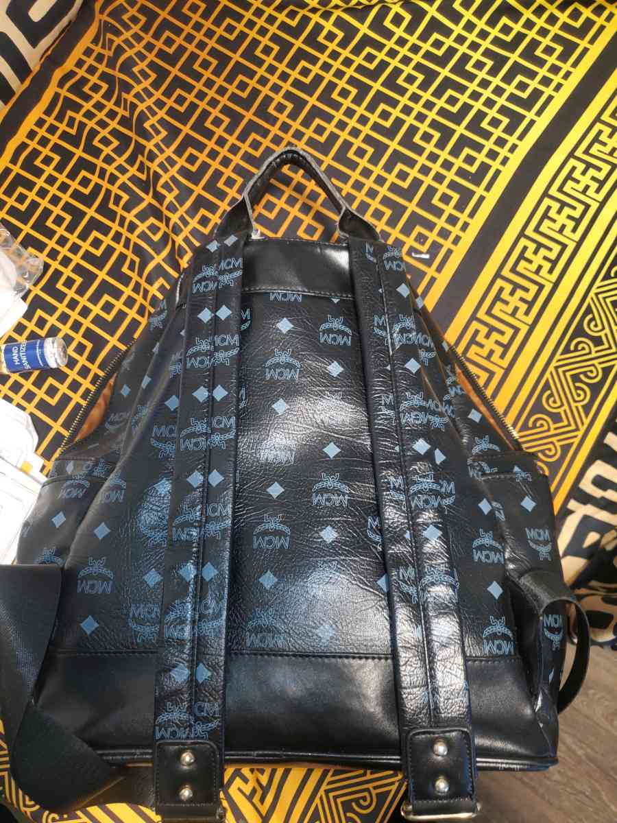 Mcm backpack black and gold