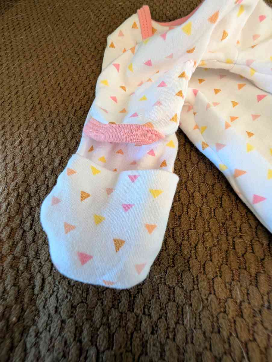 Infant gown with pink and yellow accents