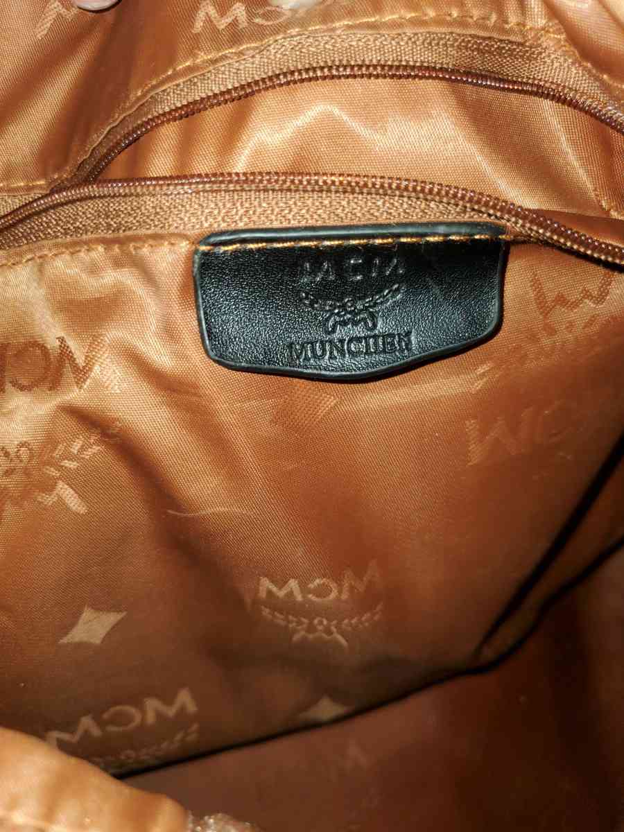 Mcm backpack black and gold