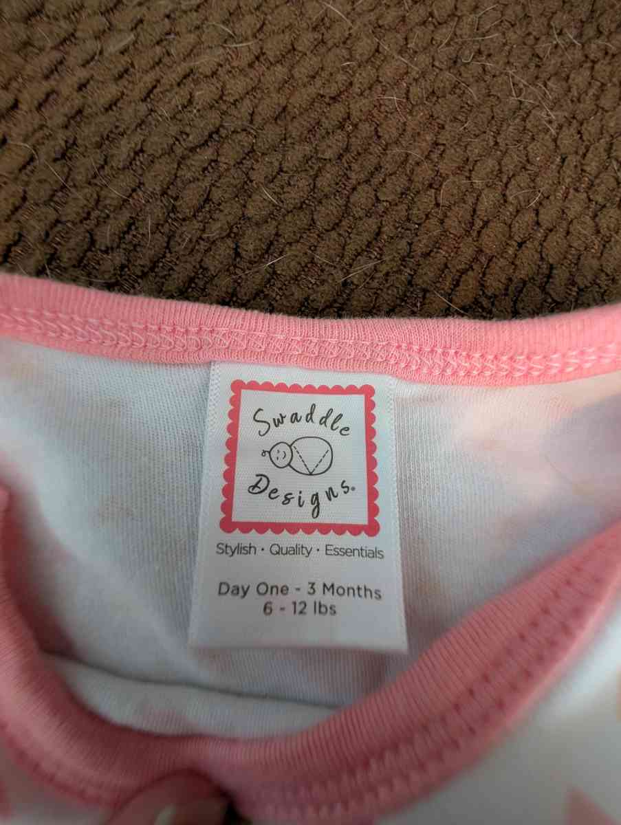 Infant gown with pink and yellow accents