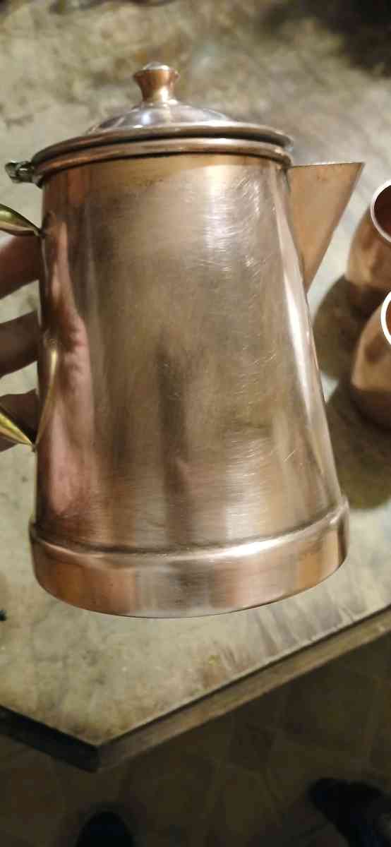 solid copper cups and a coffee pot
