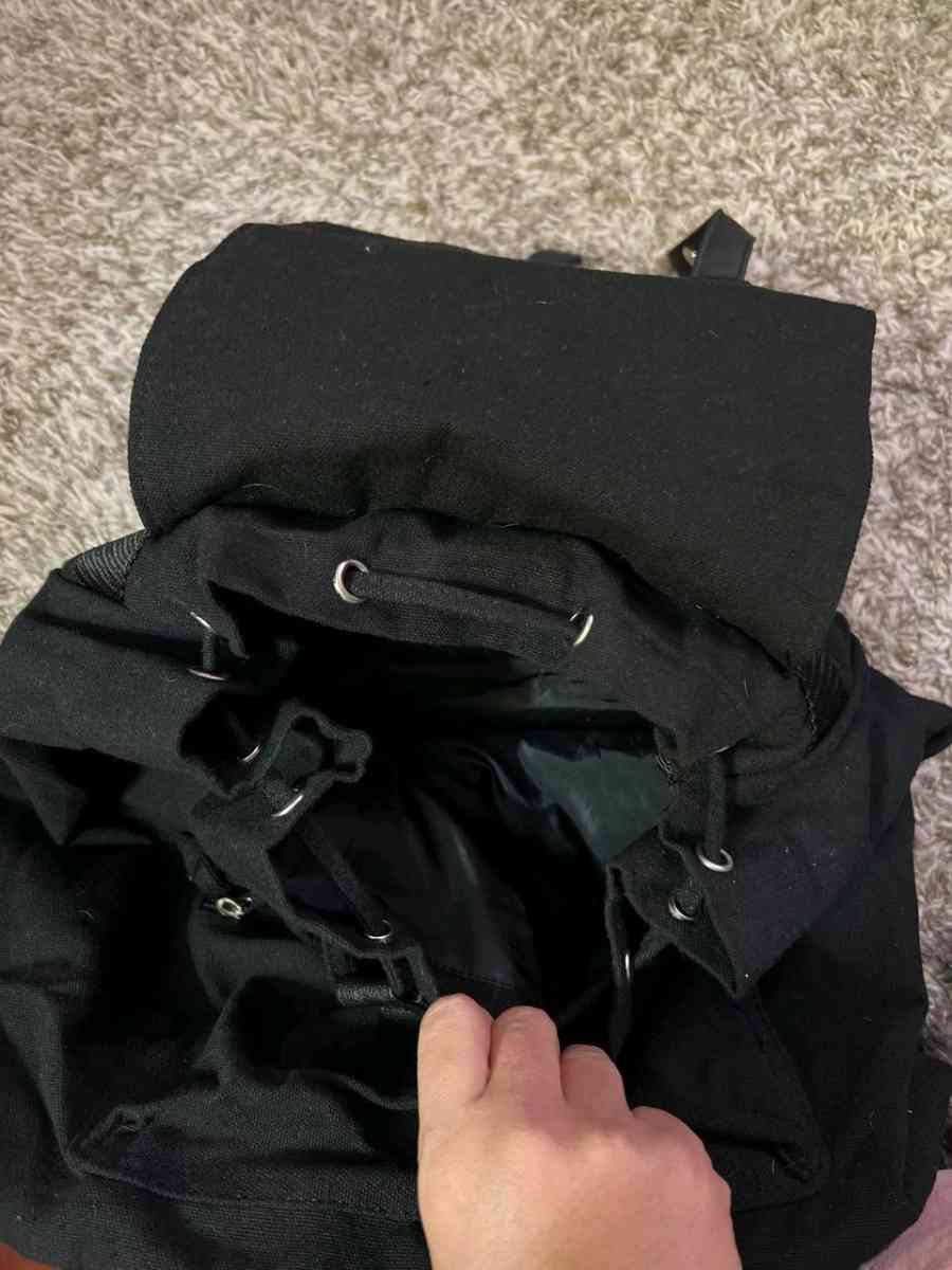 Trendy Black Canvas Backpack with Luxurious Leather Accents