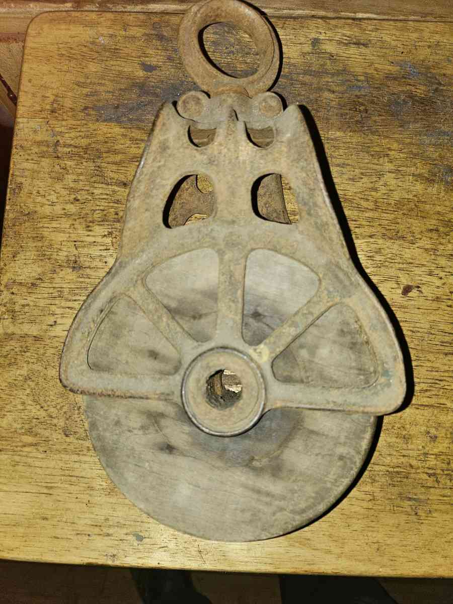 2 old wooden pulleys with metal frames 10 dollars for both