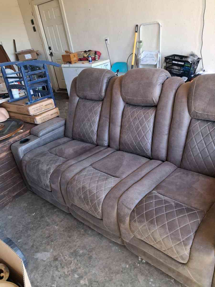 Brown suede couch the middle saint has a not lot in the midd