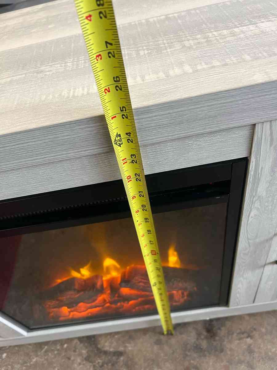 mueble para TV y chimenea en buen estado