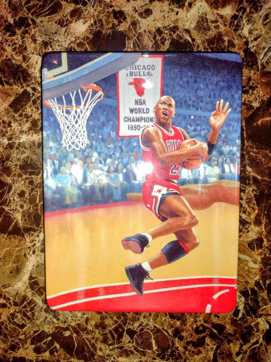 Michael Jordan soaring above the rim plate