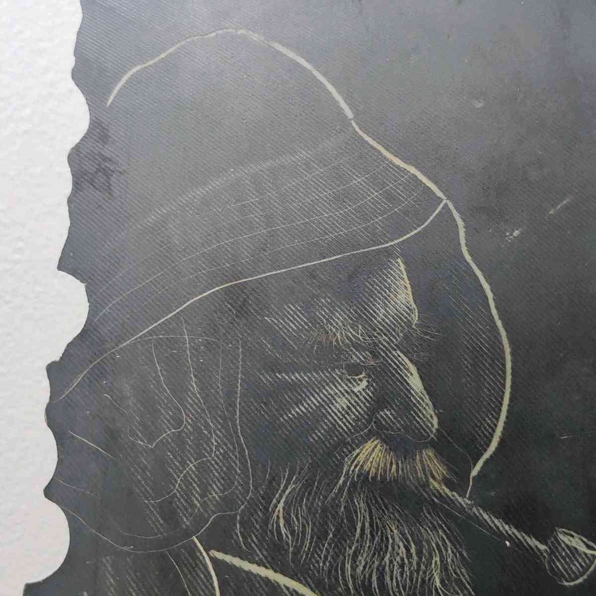 Slate drawing of a Wharf Fisherman