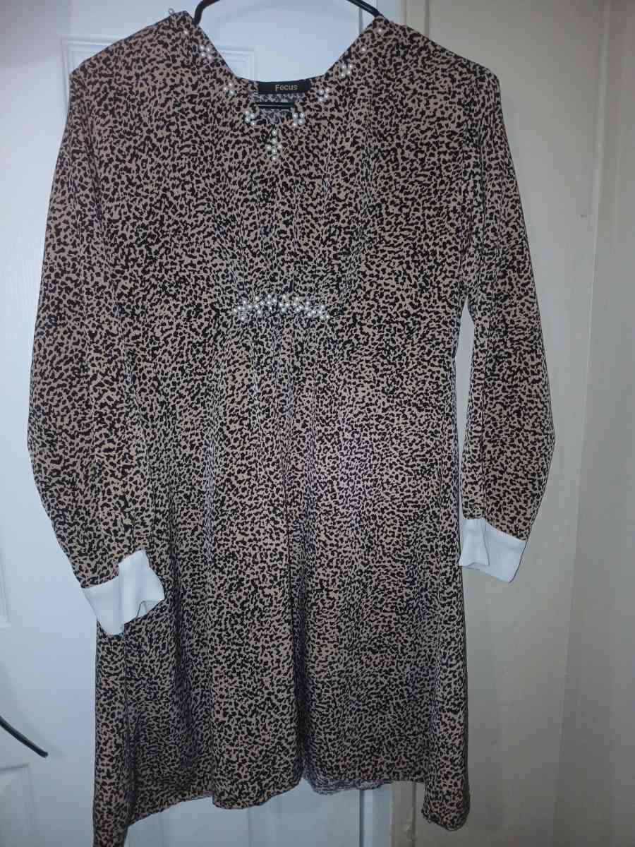 a shirt with leopard print with stones on weast
