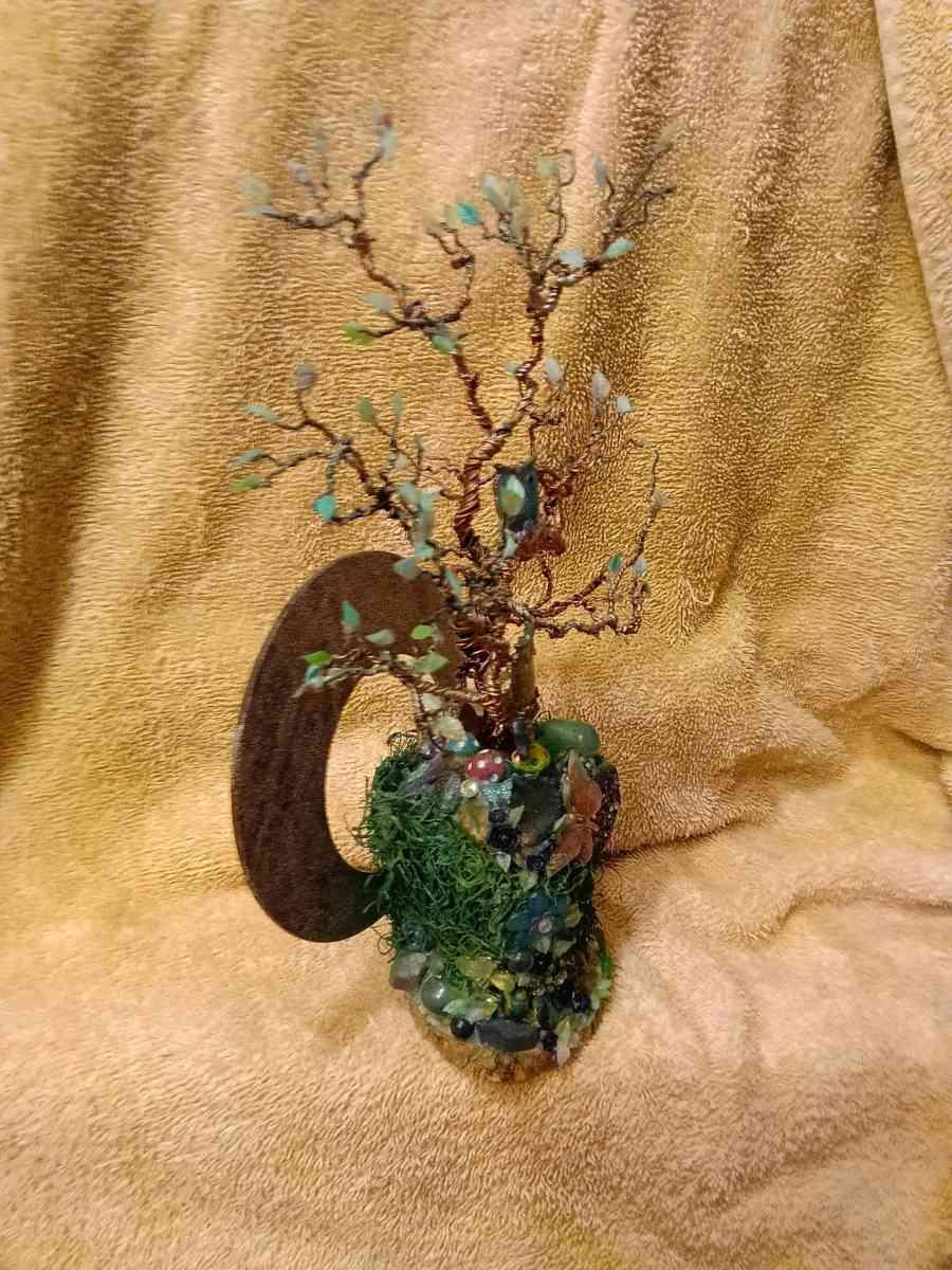 twisted copper tree with two owls