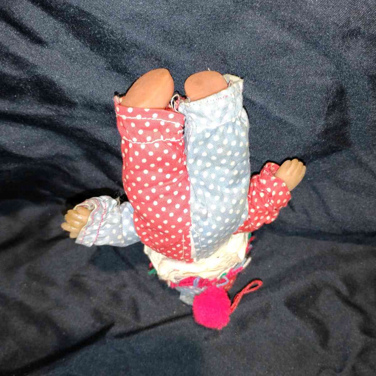 this is a vintage collectible clown doll cloth body vinyl he