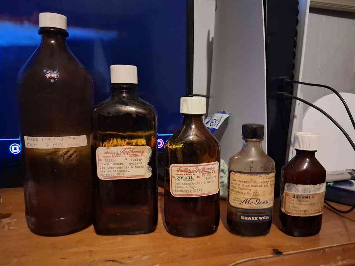 medicine bottles brown and red glass