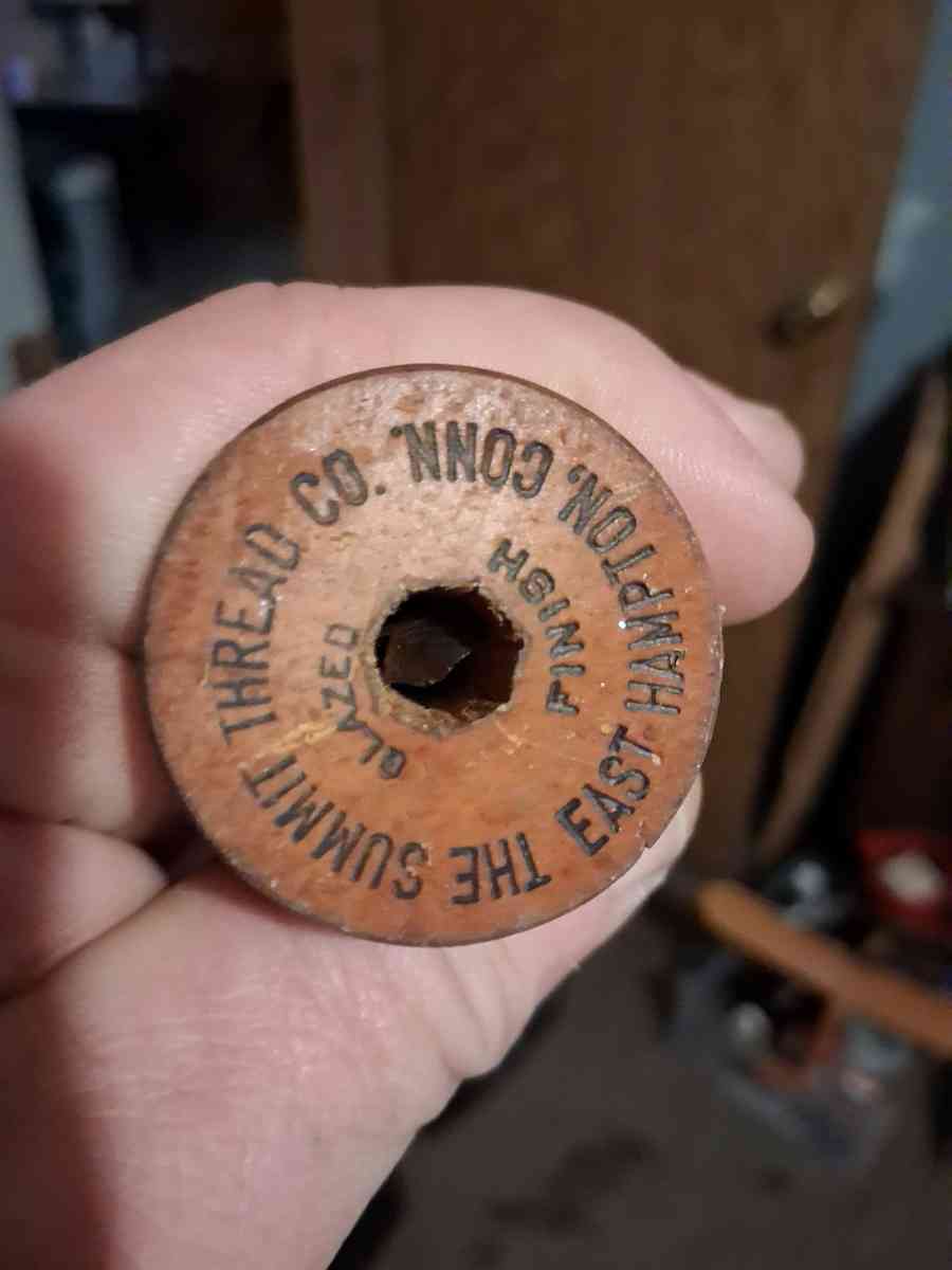 wooden thread spool 1930s has stamps on top