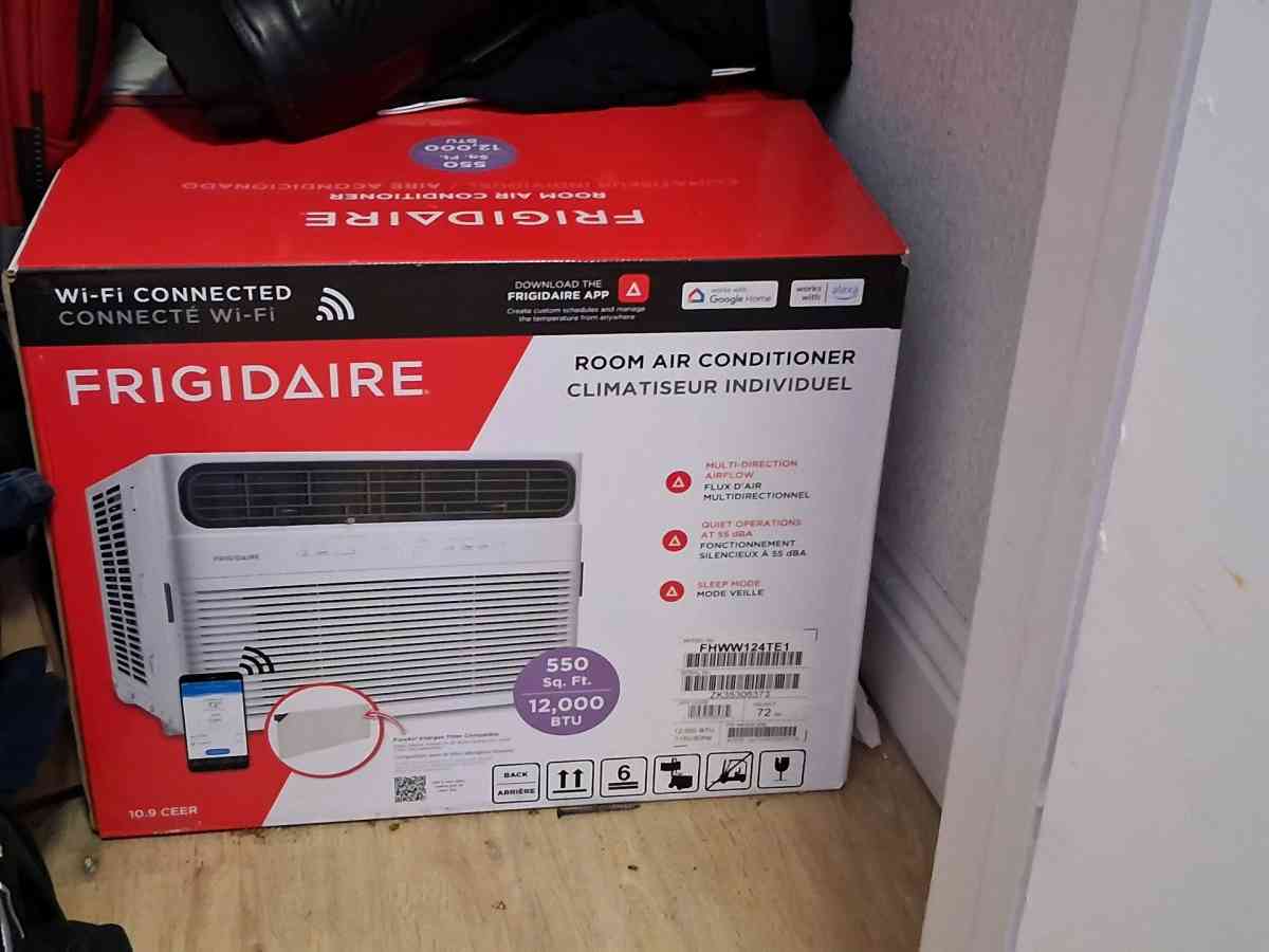 A brand new never used refrigerator and a brand new wifi AC